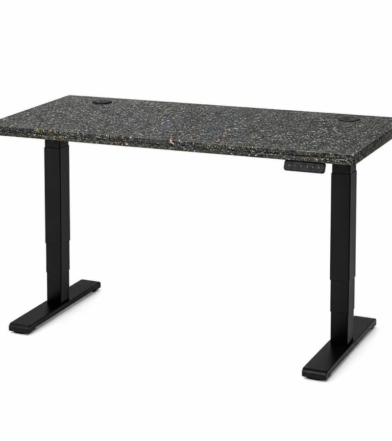 Height adjustable sit-stand desk with speckled recycled plastic top showing mixed color flecks and natural recycle