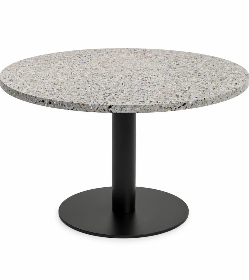 Round meeting table with speckled recycled plastic top showing mixed color flecks and natural recycled texture,